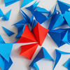 A majority of blue paper triangles, a minority of red paper triangles A majority of blue paper triangles, a minority of red paper triangles