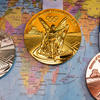 medals with a world map on the background