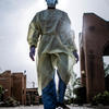 Nurse walking by a hospital building Nurse walking by a hospital building