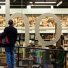 man staring at a large shop