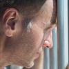 inmate holding prison bars