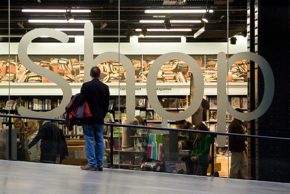 man staring at a large shop